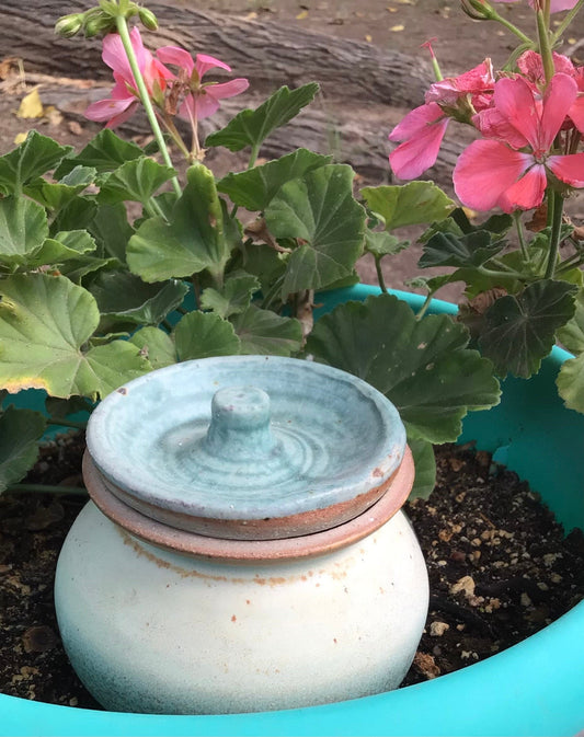 Turquoise and white lidded pot